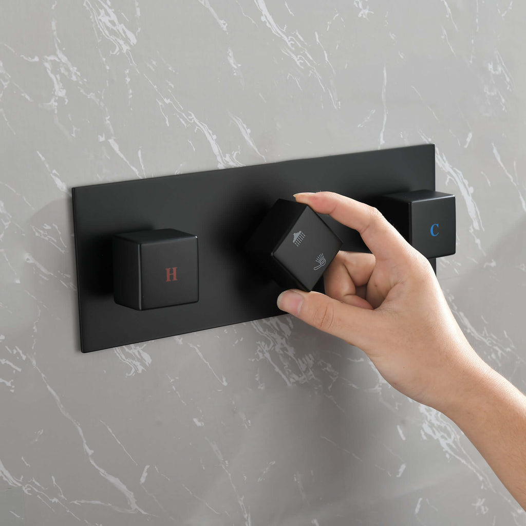 Nestivora Matte Black Shower System - Sleek & Stylish Design showing user adjusting controls on a matte black panel.